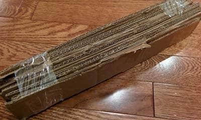 cat scratching cardboard stack Stack of cardboard taped together